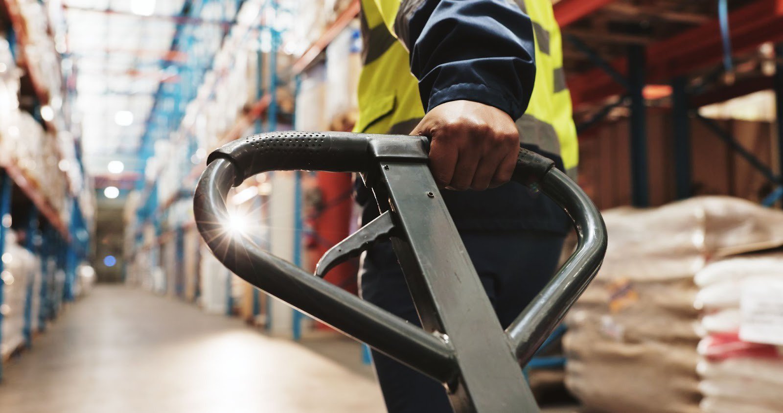 a man in a warehouse illustrating the advantages of partnering with a 3PL